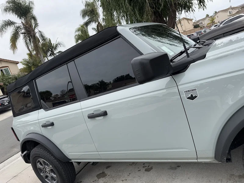 White SUV with dark side windows, photographed by Google reviewer genessis michel