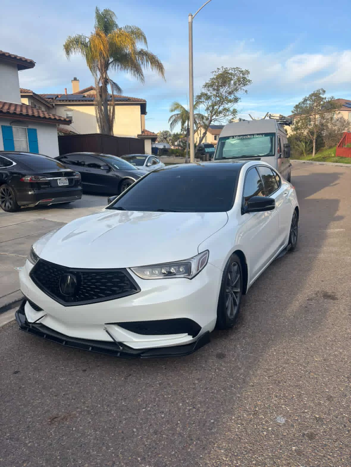White Acura with dark windows in the official tint gallery